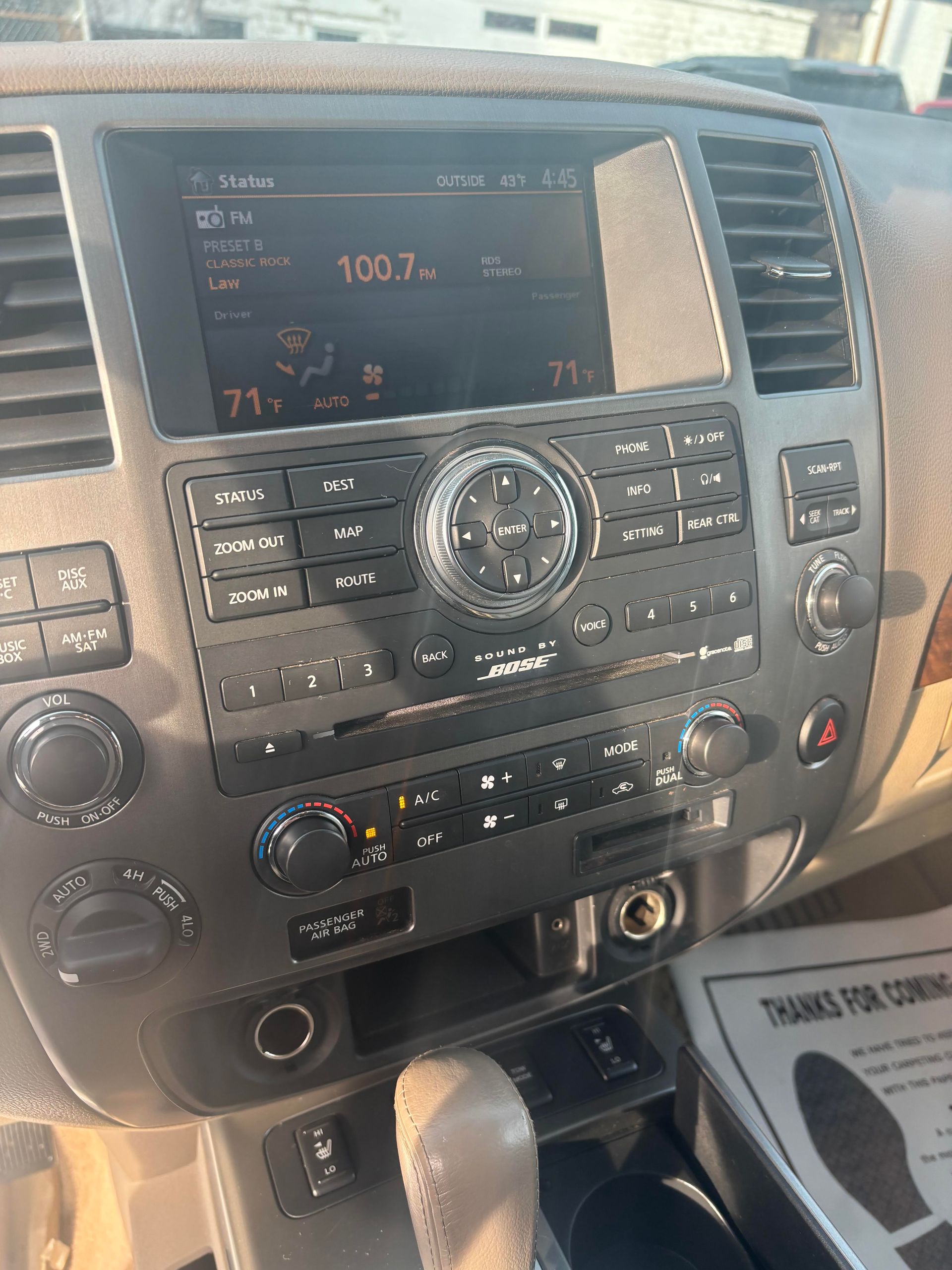 Infotainment and dashboard controls of Nissan Armada SUV at Lou’s Custom Exhaust Worcester