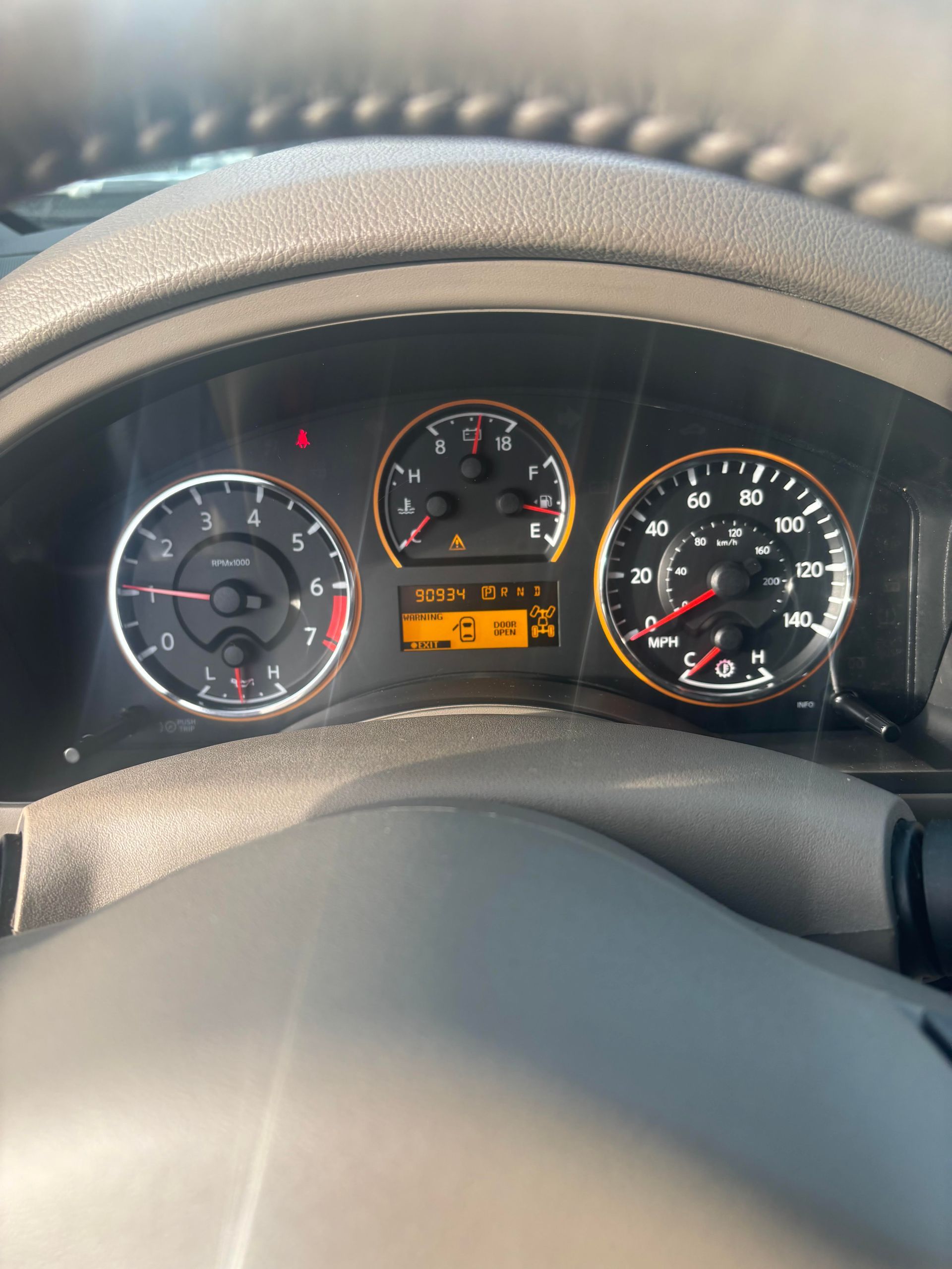 Odometer and gauge cluster of Nissan Armada SUV for sale at Lou’s Custom Exhaust Worcester MA