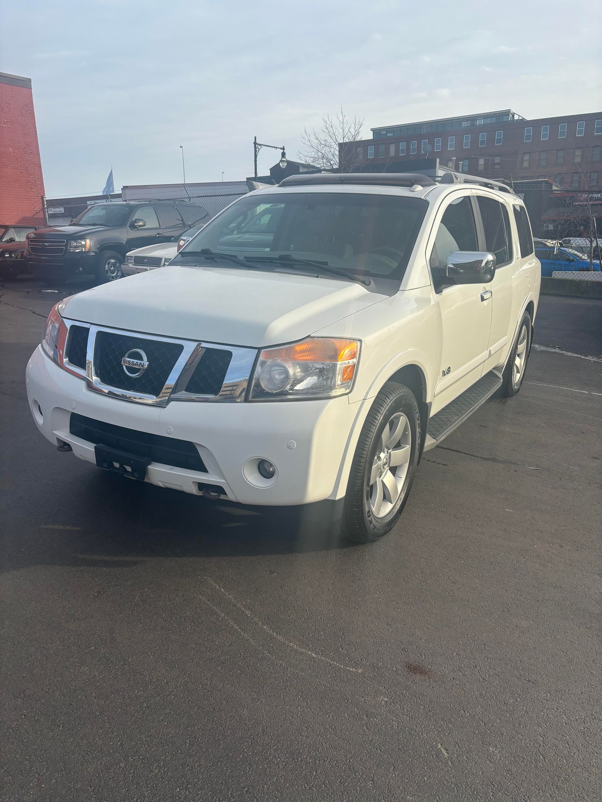 White Nissan Armada SUV parked at Lou’s Custom Exhaust Worcester MA
