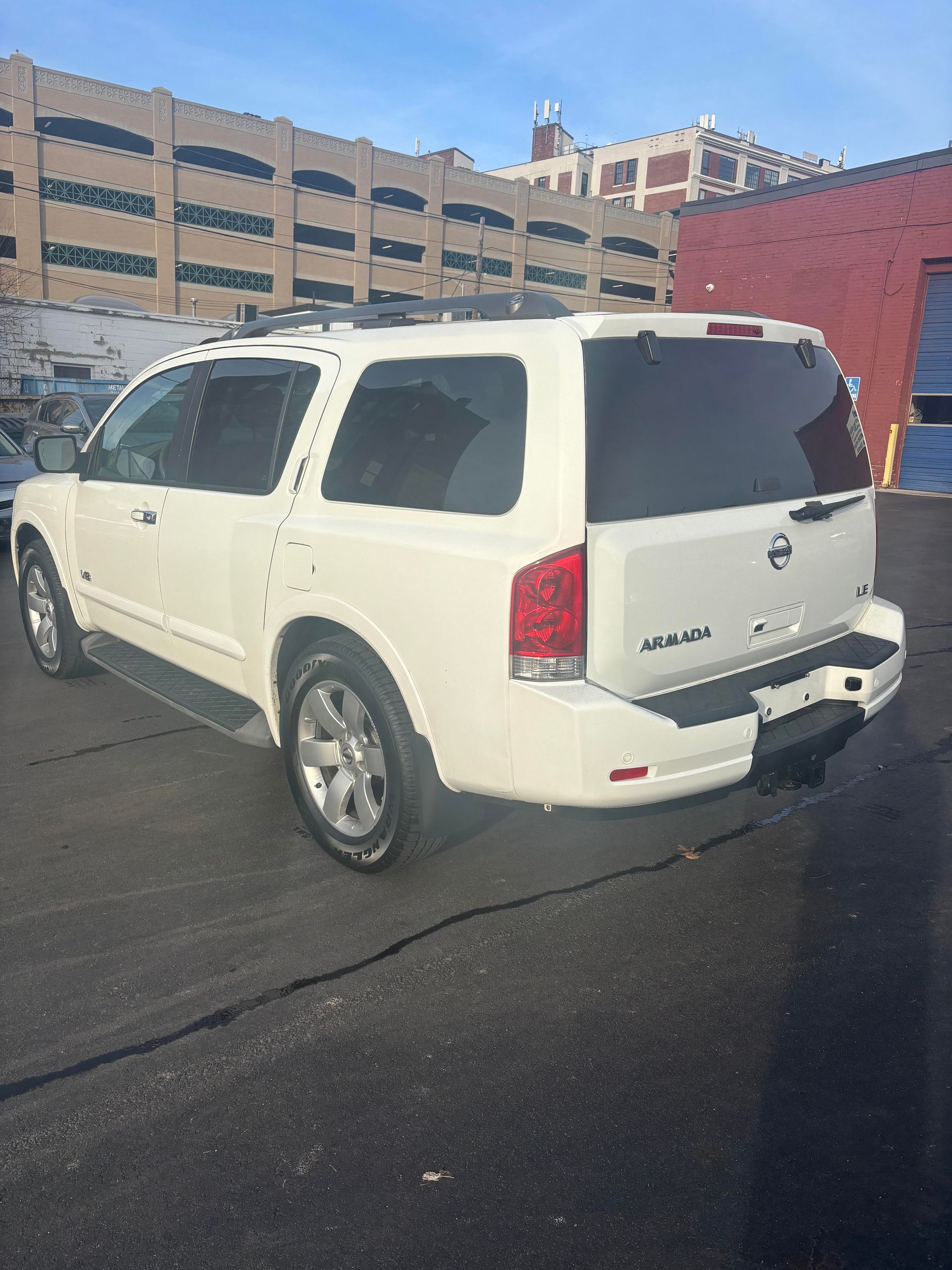 White Nissan Armada SUV for sale at Lou’s Custom Exhaust Worcester MA