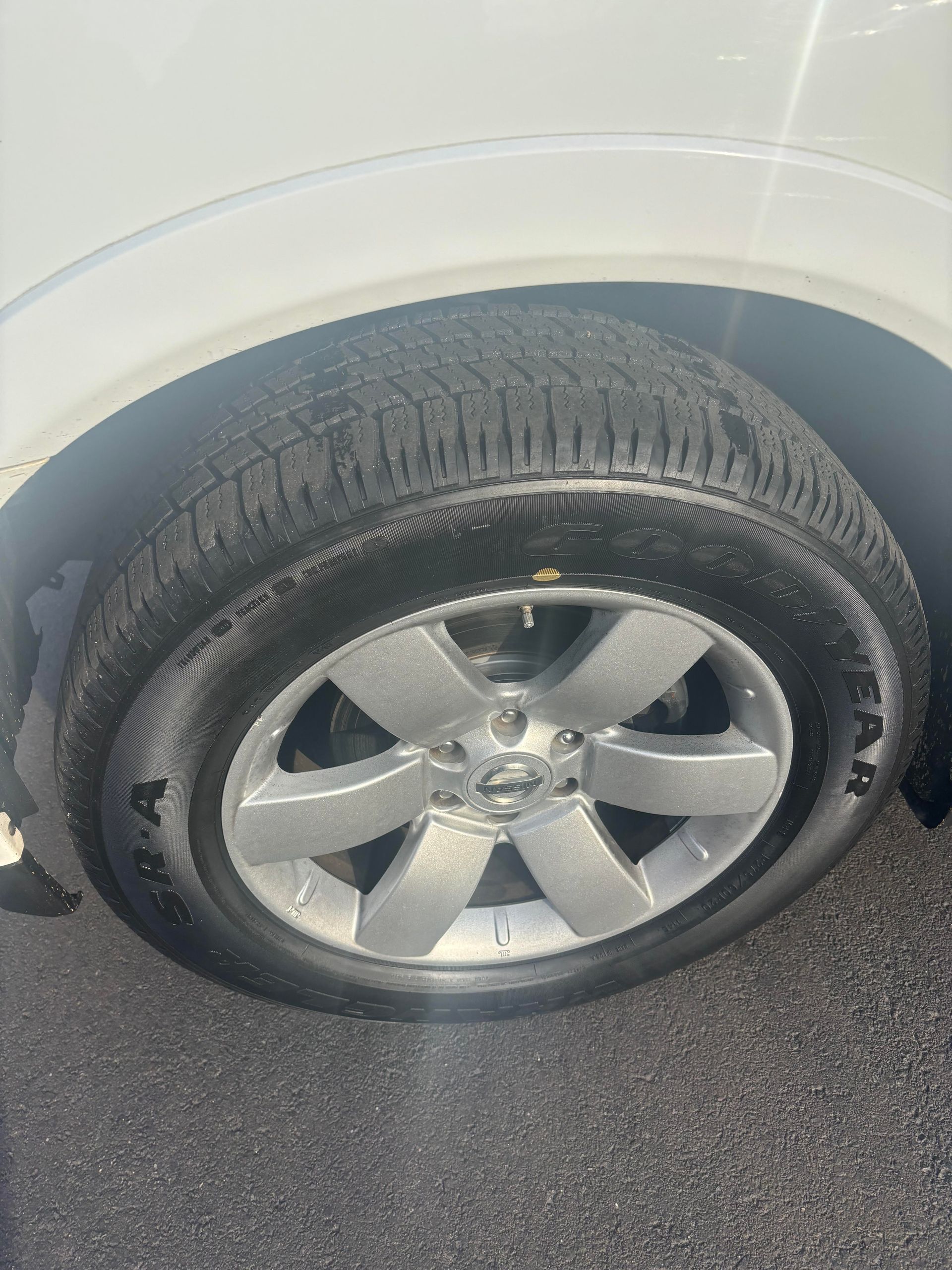 Close-up of Nissan Armada front tire and wheel at Lou’s Custom Exhaust Worcester MA