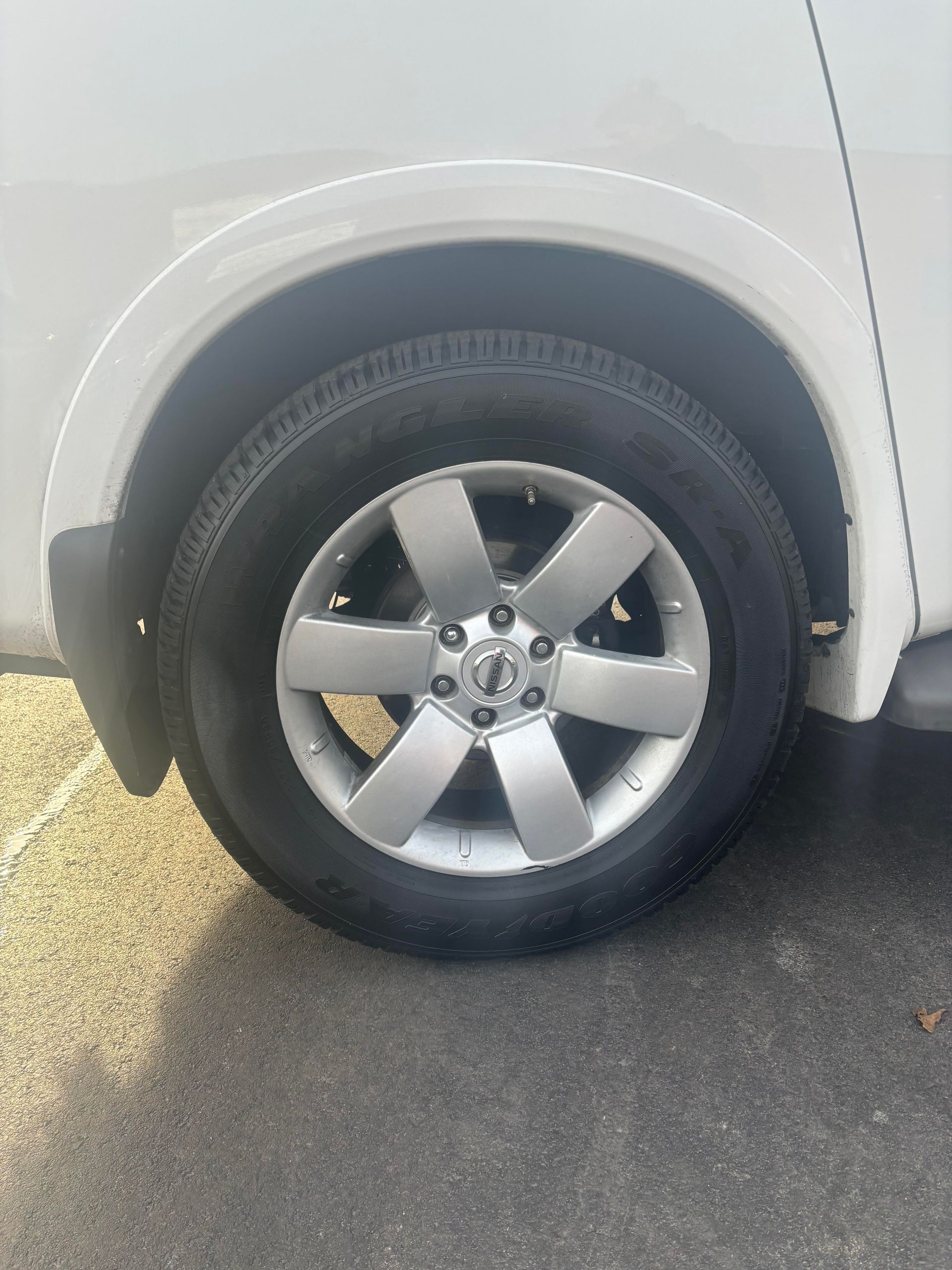 Close-up of Nissan Armada tire and wheel at Lou’s Custom Exhaust Worcester MA