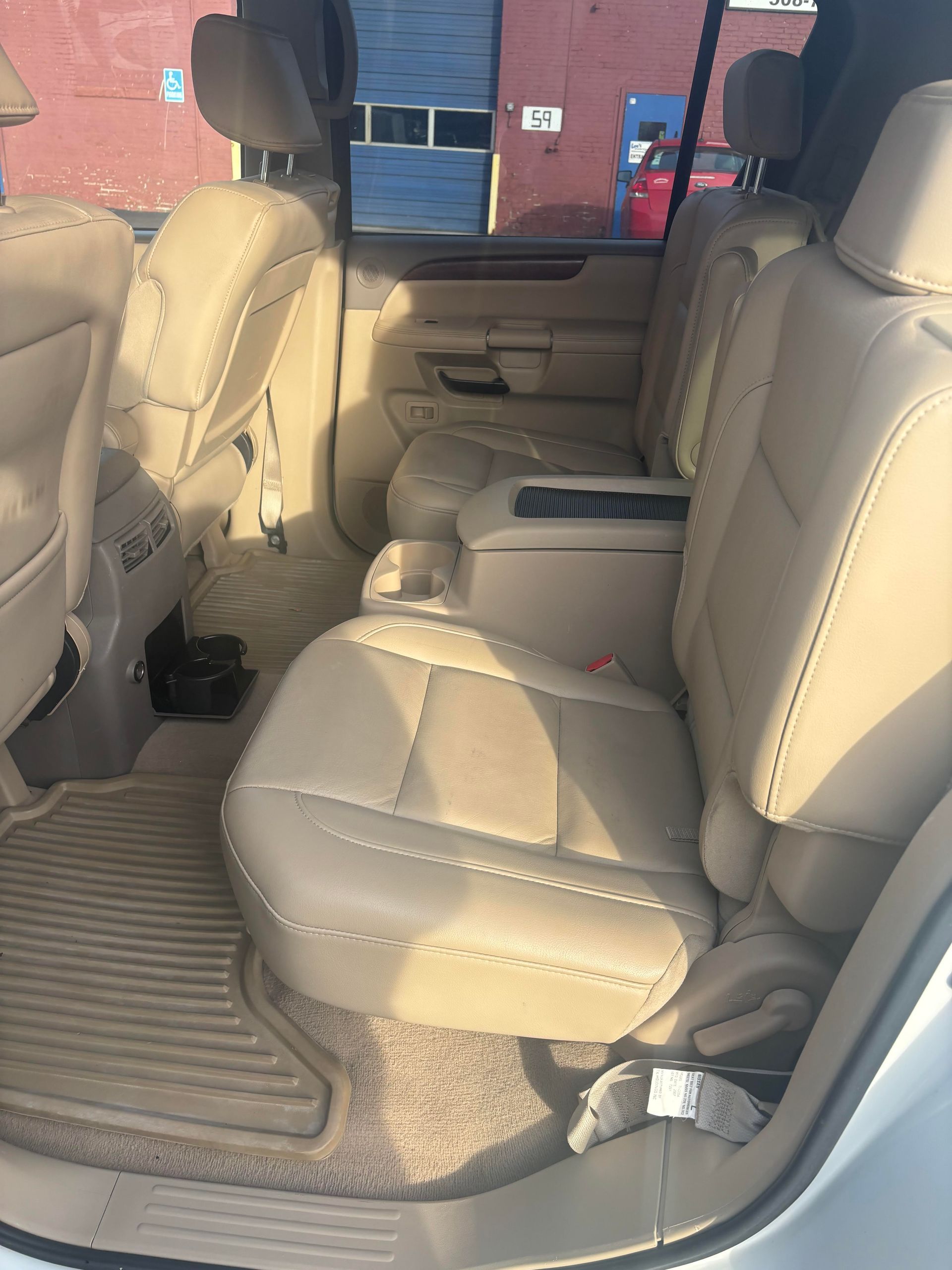 Second-row leather seats in Nissan Armada SUV at Lou’s Custom Exhaust Worcester MA