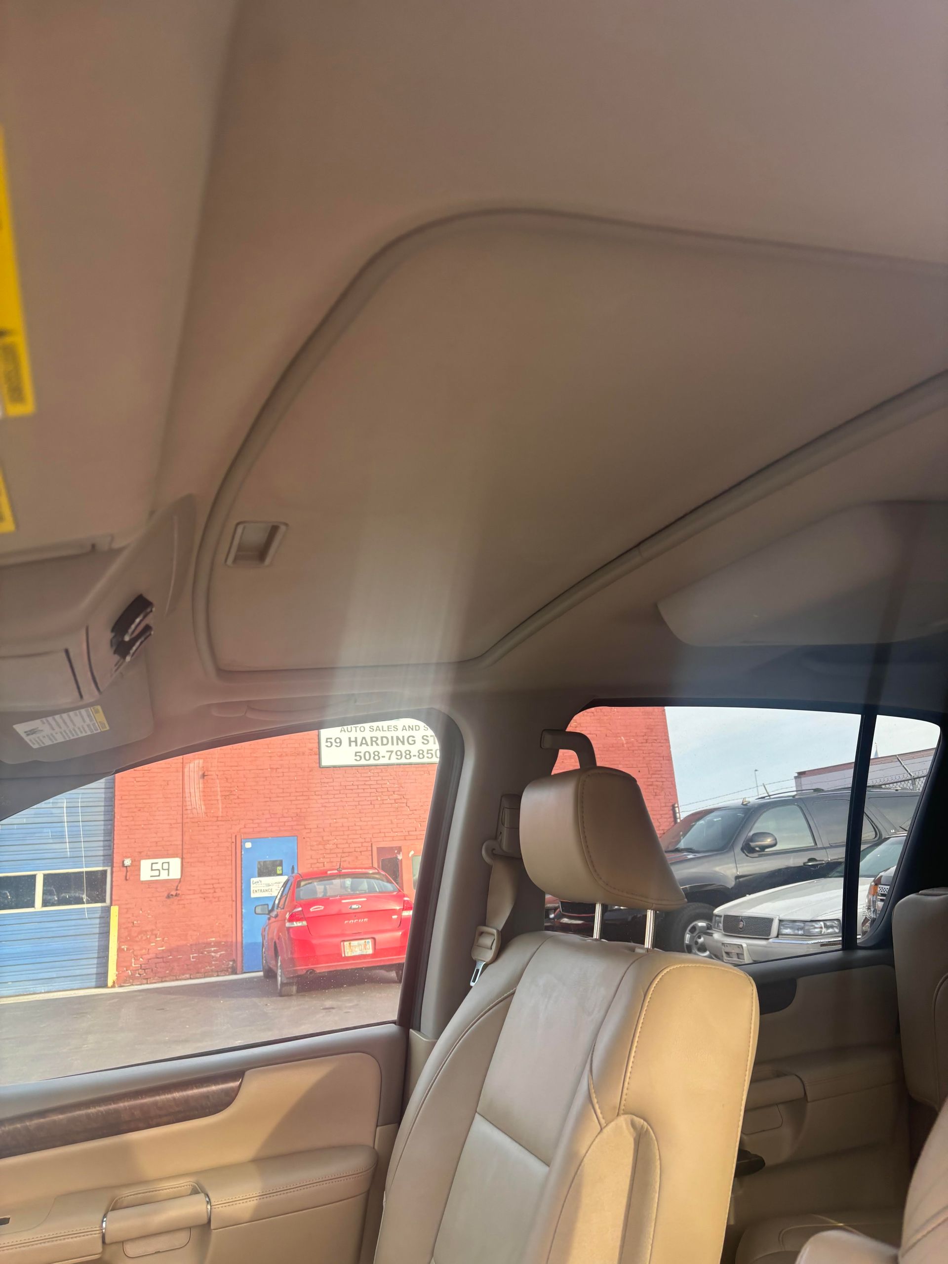 Interior roof and sunroof view of Nissan Armada SUV at Lou’s Custom Exhaust Worcester MA