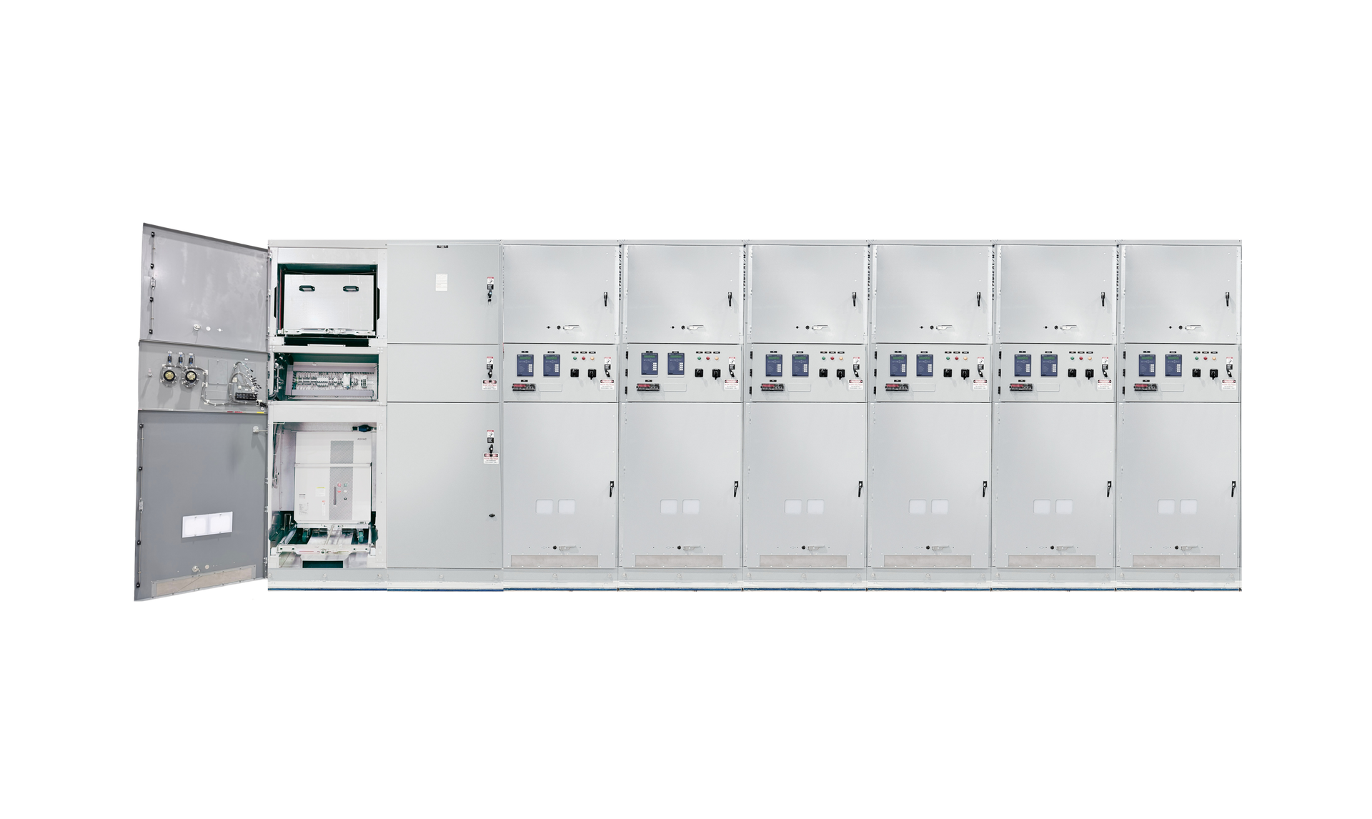 Open electrical control cabinet with rows of gray panels and wiring compartments exposed on the left