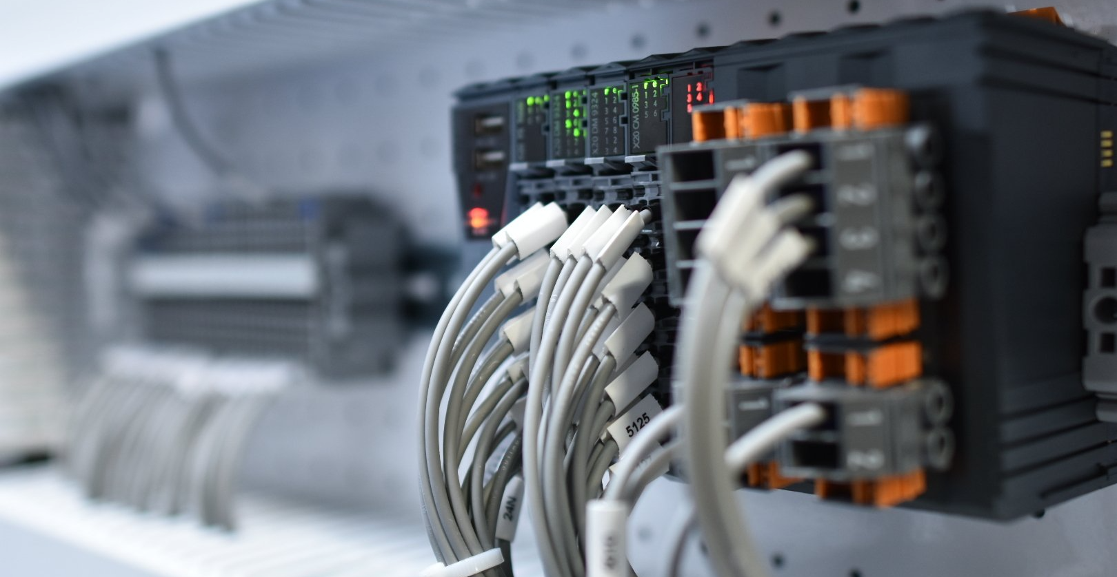 A bunch of wires are connected to a machine.