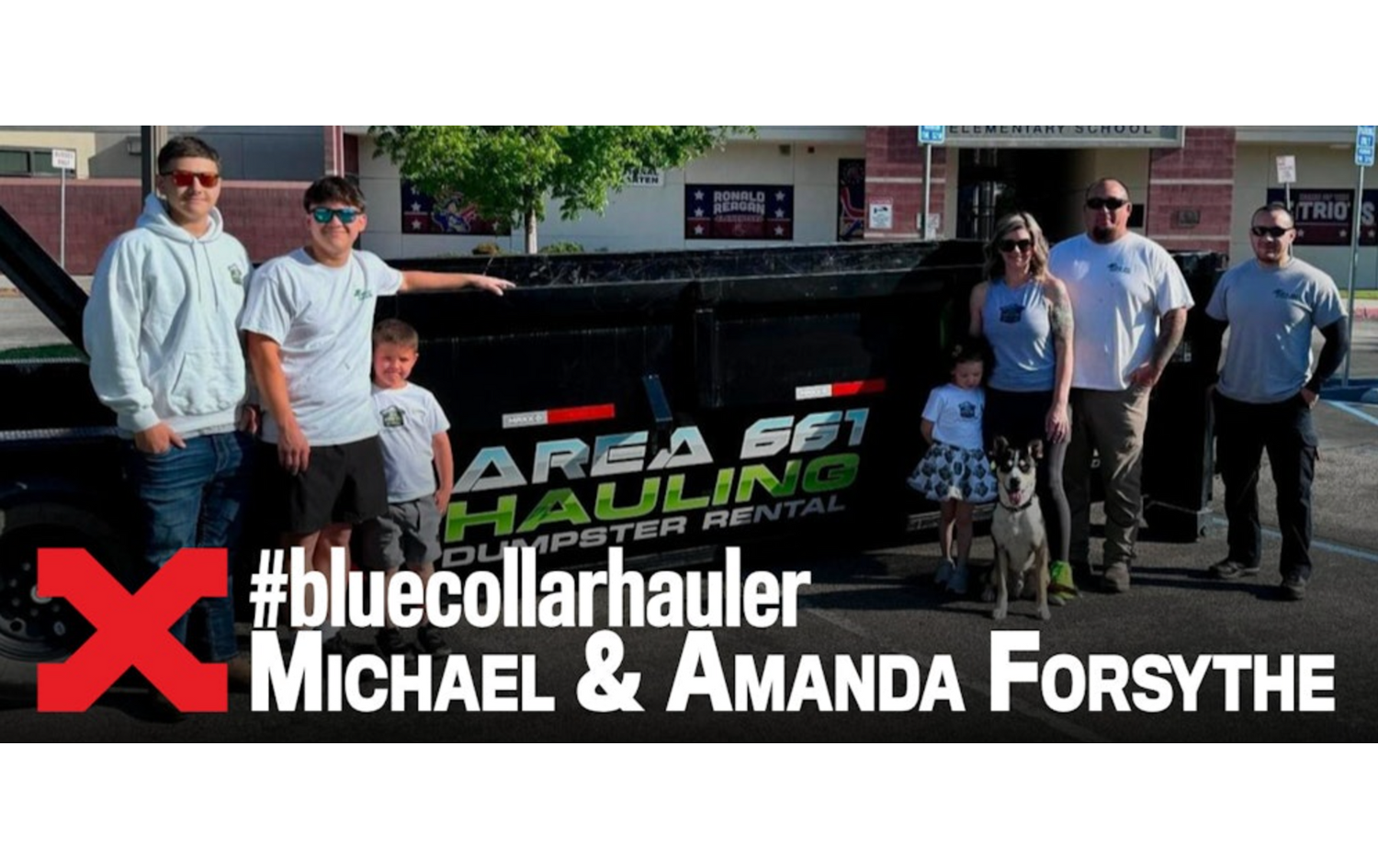 A group of people standing in front of a truck that says area 601 hauling in Bakersfield, CA