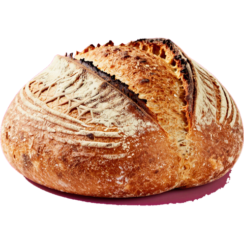 Pagnotta rotonda e croccante di pane artigianale con la superficie incisa di colore marrone dorato.