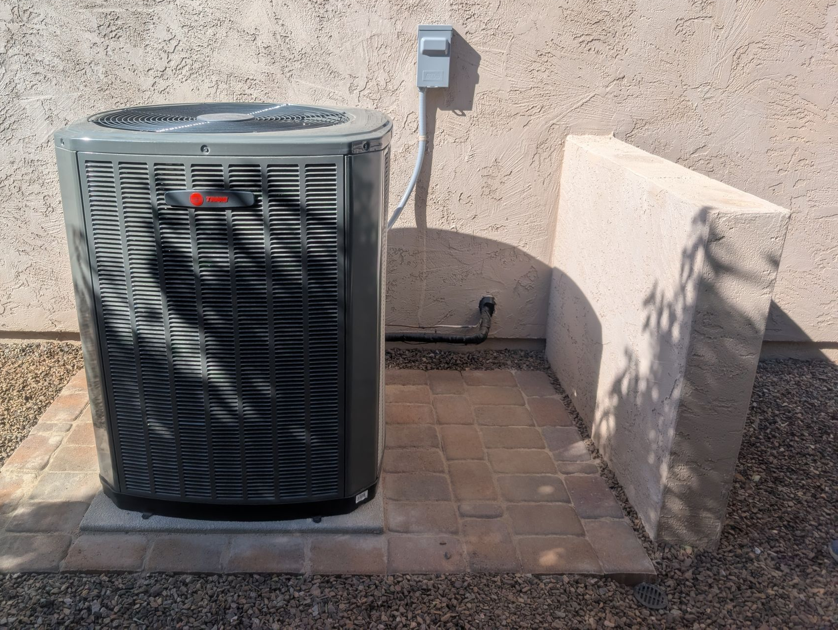 Schiller technician connecting HEPA vacuum equipment to ductwork access point
