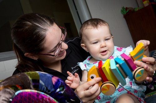 Woman and a Toddler Playing with a Toy — Darwin, NT — Territory Child Care Group