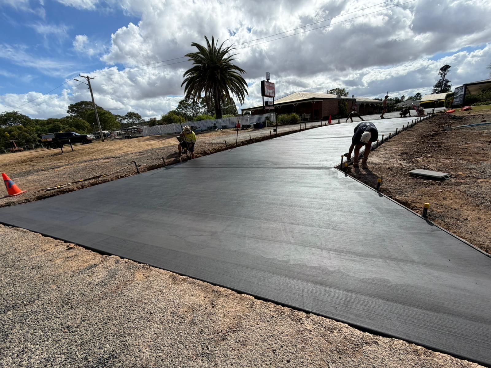 Freshly Paved Black Road Under Construction — TP Concreting In Warilla, NSW