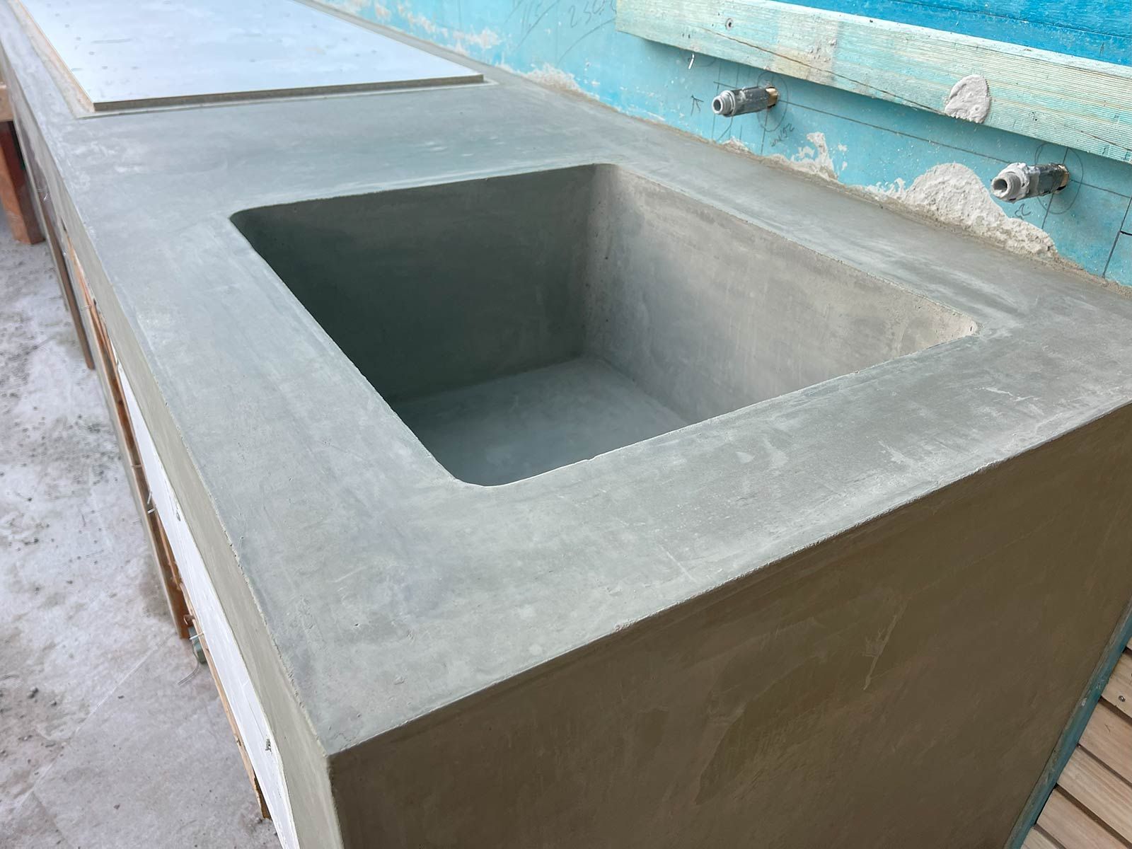 A Concrete Sink Is Sitting On Top Of A Concrete Counter — TP Concreting In Warilla, NSW