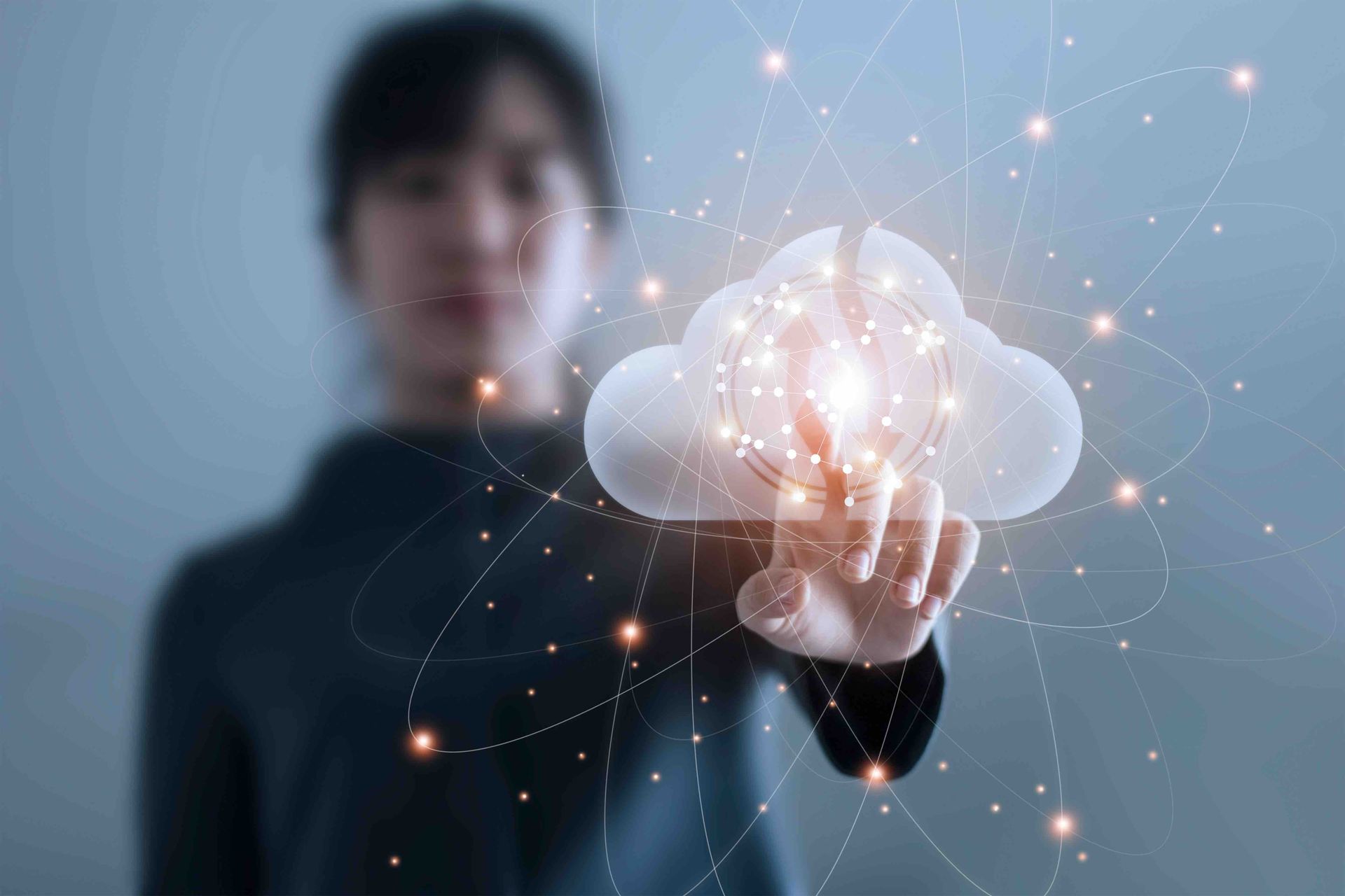 A woman is holding a cloud in her hand.