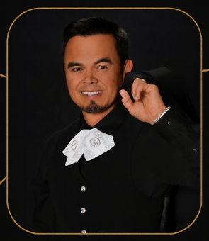 Mariachi band playing guitars on a cobblestone street with colorful buildings.