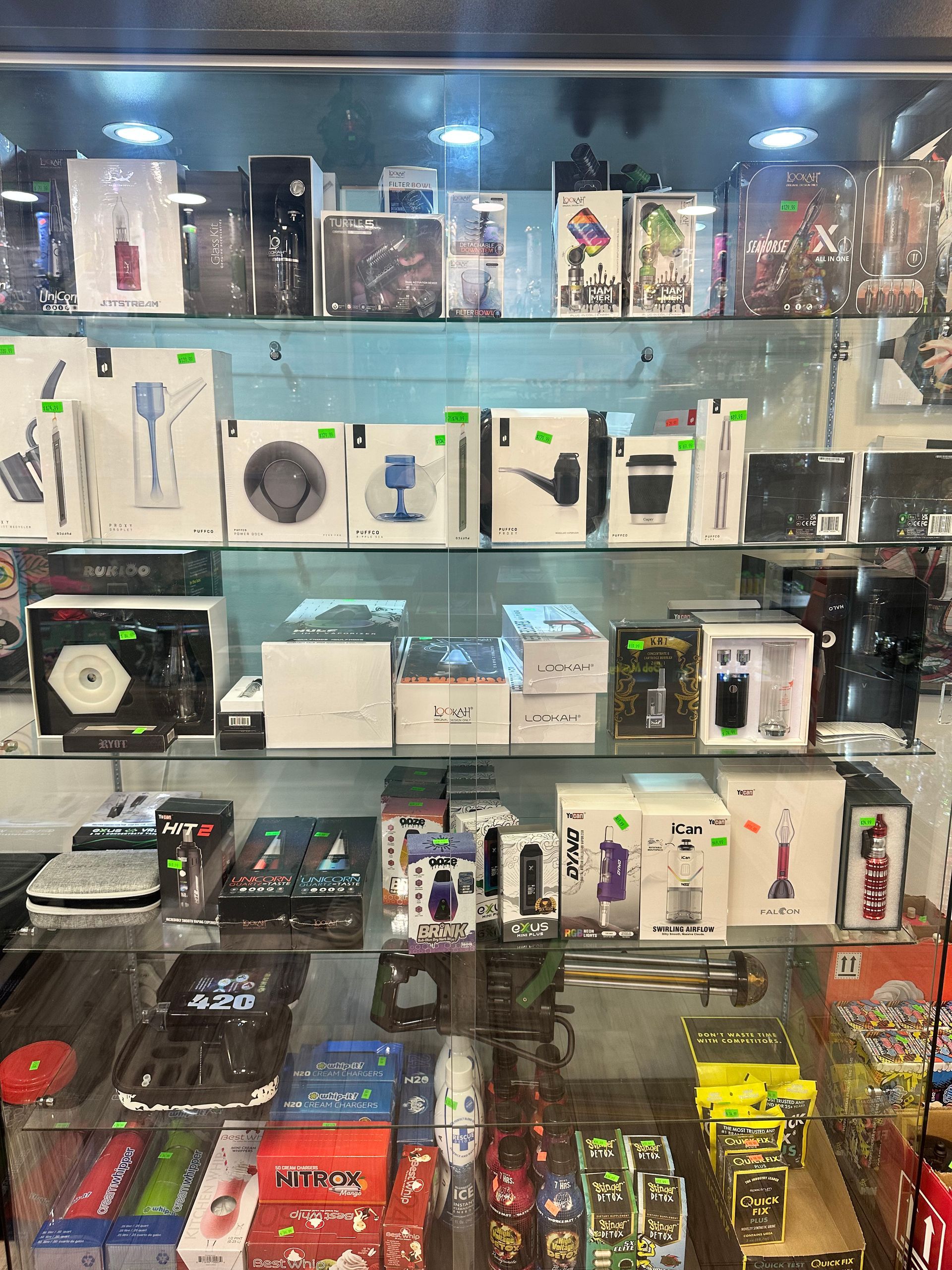 A store display case filled with lots of electronic devices.