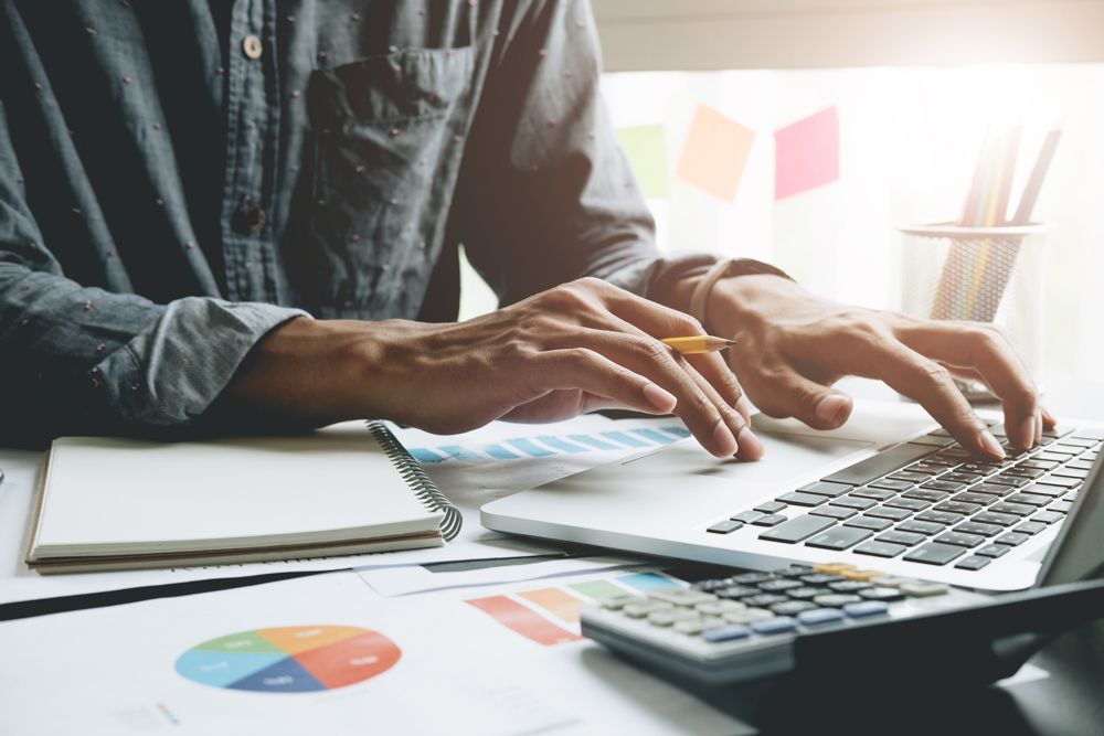 Tax Expert Using a Laptop — Parkes, NSW — Peter Woods & Associates Tax Expert Using a Laptop — Parkes, NSW — Peter Woods & Associates