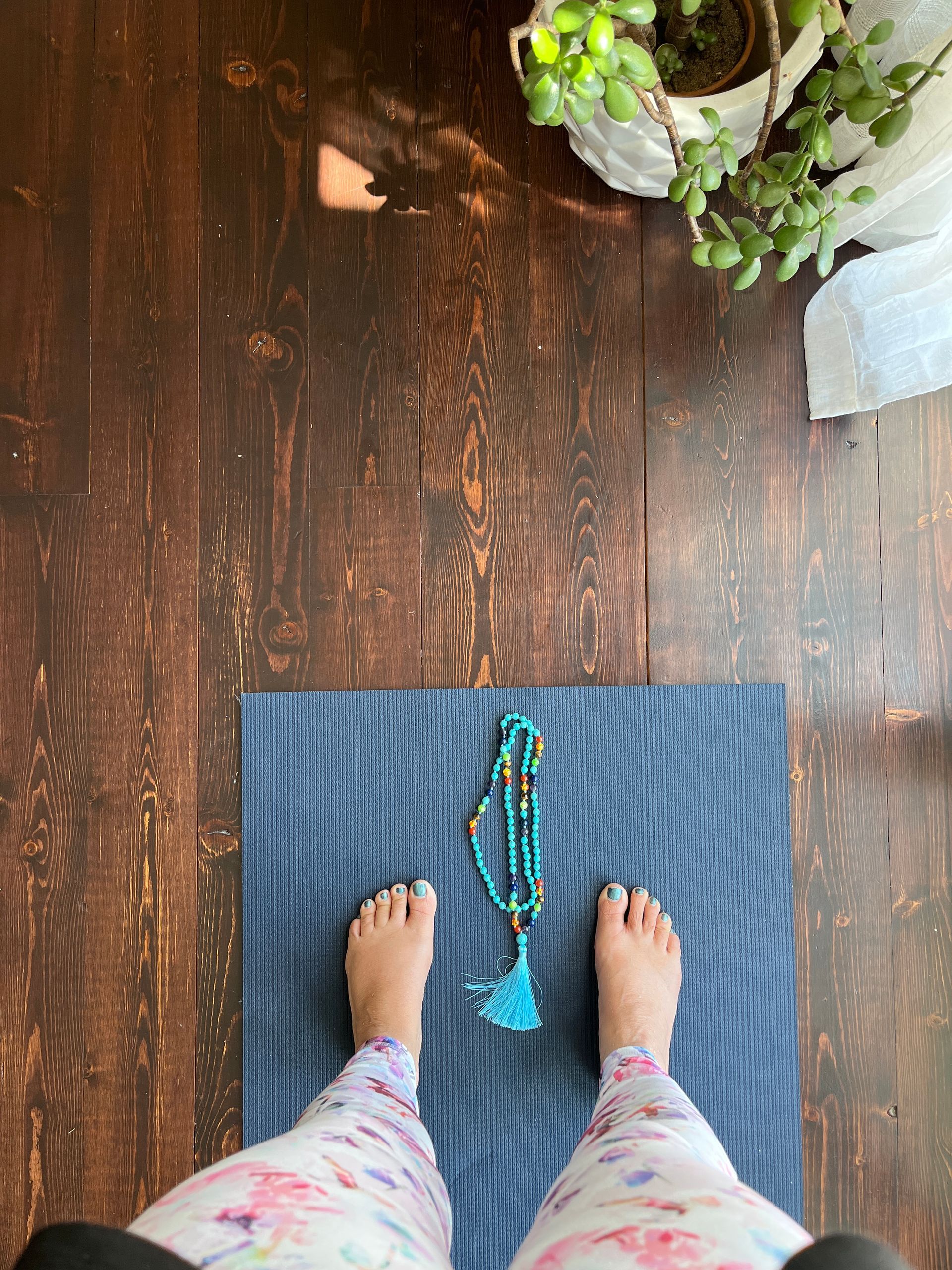 Sun Saluation On a Yoga Mat with Mala Beads