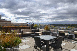 exterior photo of rooftop deck with table