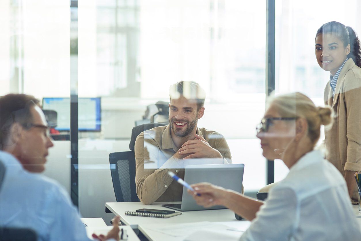 Group of diverse lawyers in an office discussing about content marketing strategies.