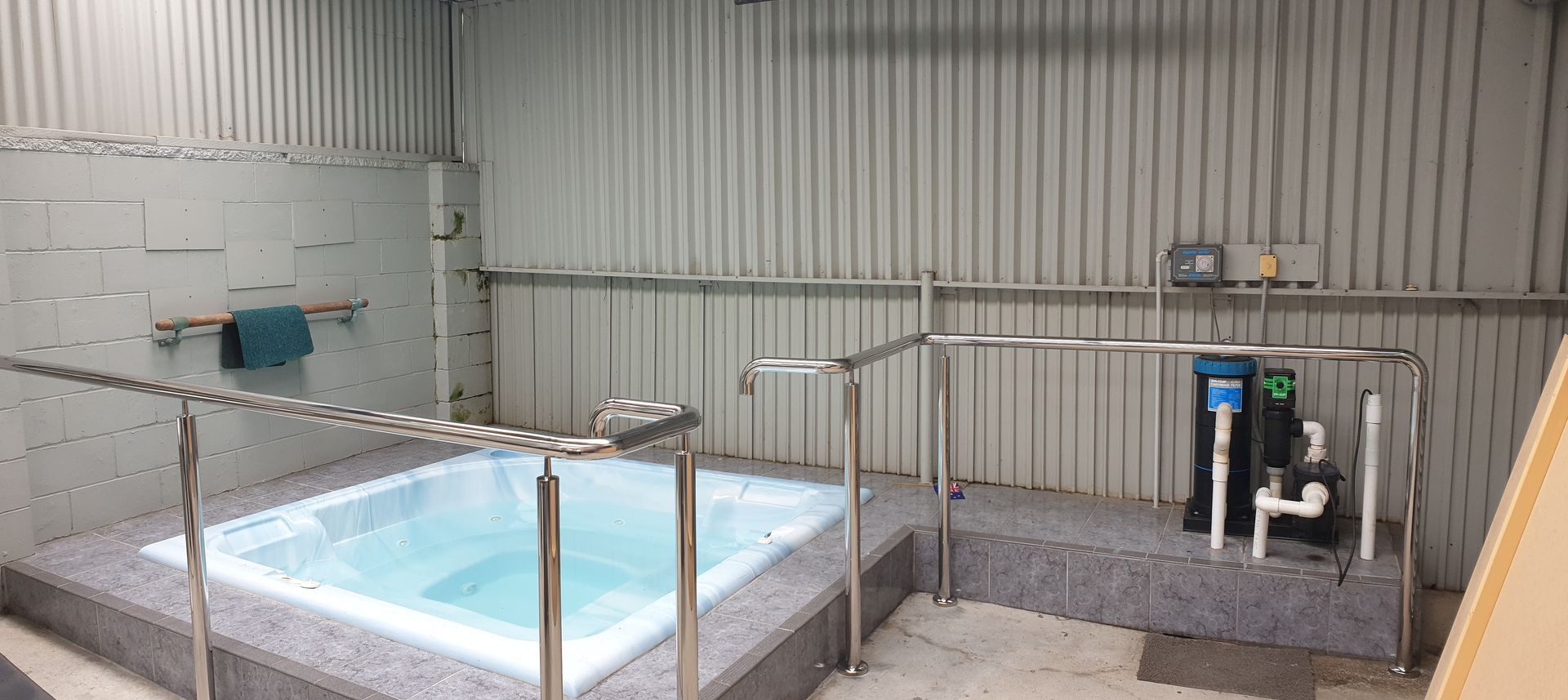 There is a large bathtub in the middle of the room.