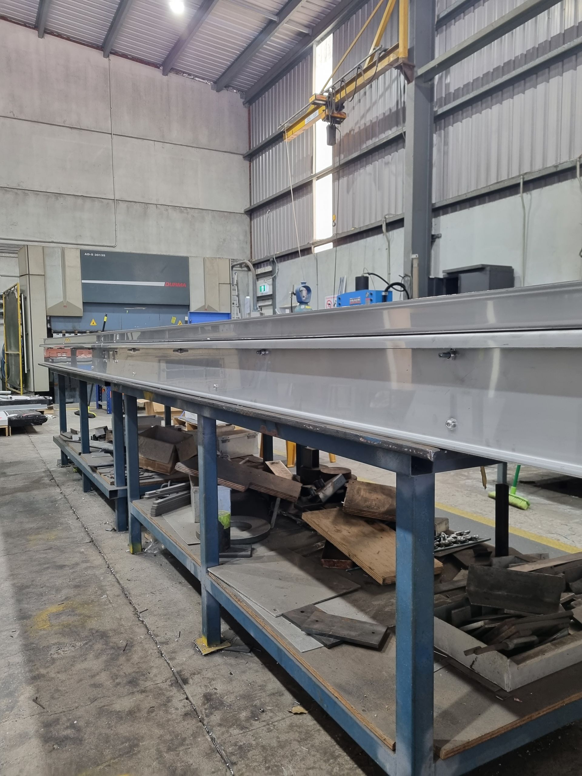 A warehouse filled with lots of tables and machinery.
