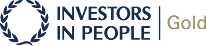 A logo for investors in people gold with a laurel wreath.