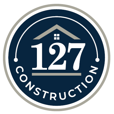 The logo for 127 construction is a circle with a house on it.