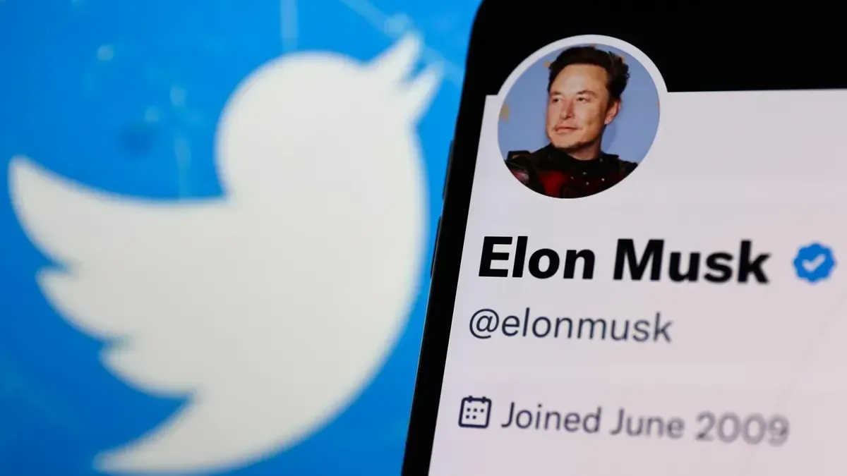 A phone with elon musk 's twitter account on it