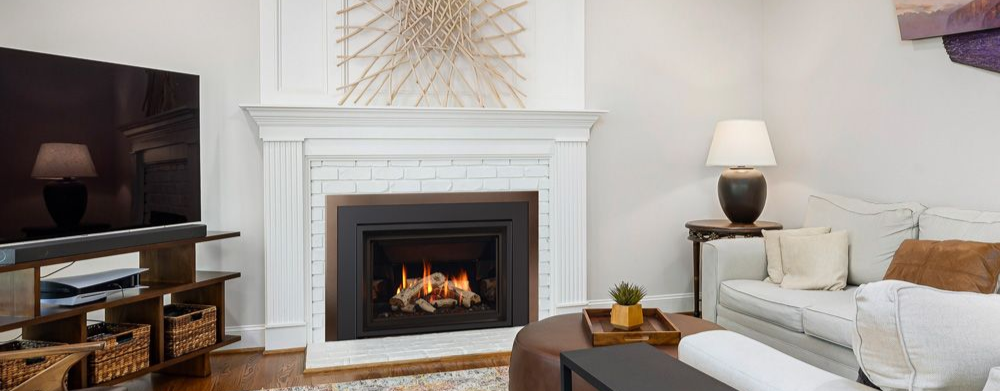 Gas fireplace with white mantel in a cozy living room