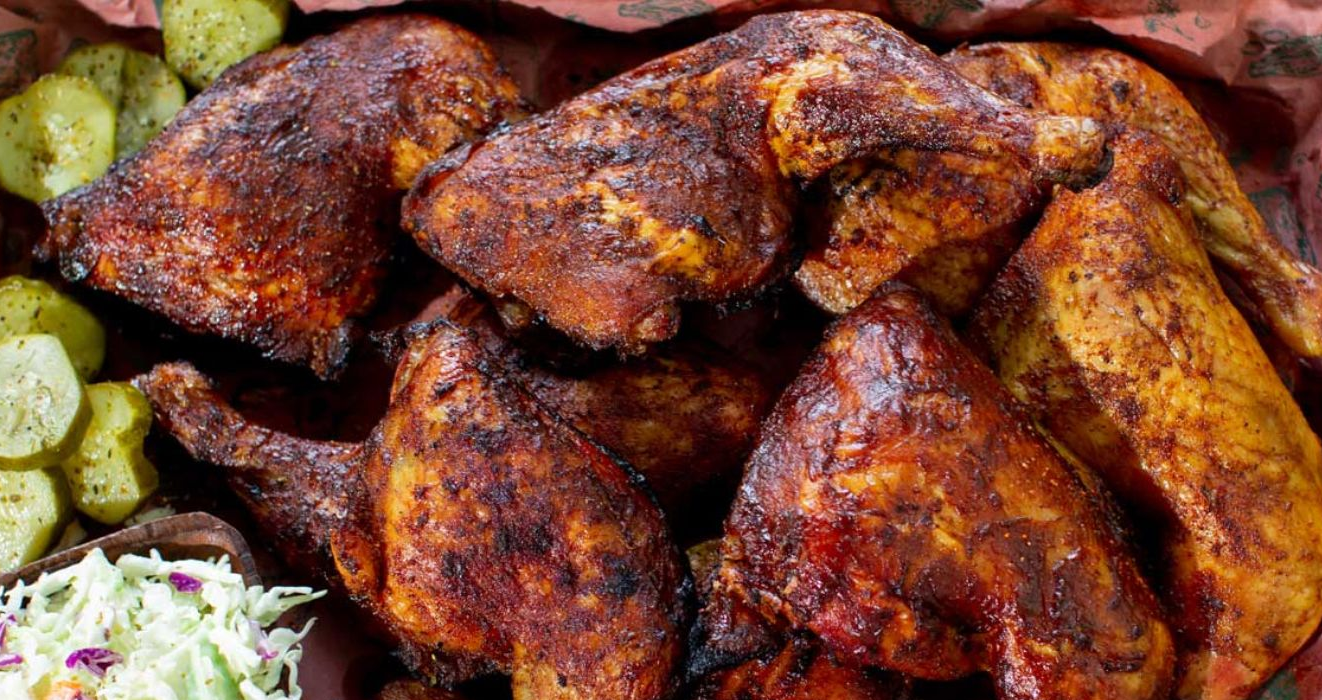 Applewood-smoked barbecue chicken glazed with Kansas City style sauce on a Big Green Egg grill