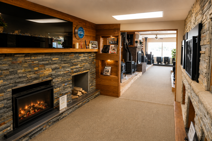 Fireplace showroom with gas fireplaces, wood stoves, and hearth displays at Capital City Stove & Grill Center in Olympia WA