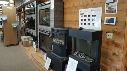 Gas fireplace and stove displays inside the Olympia showroom