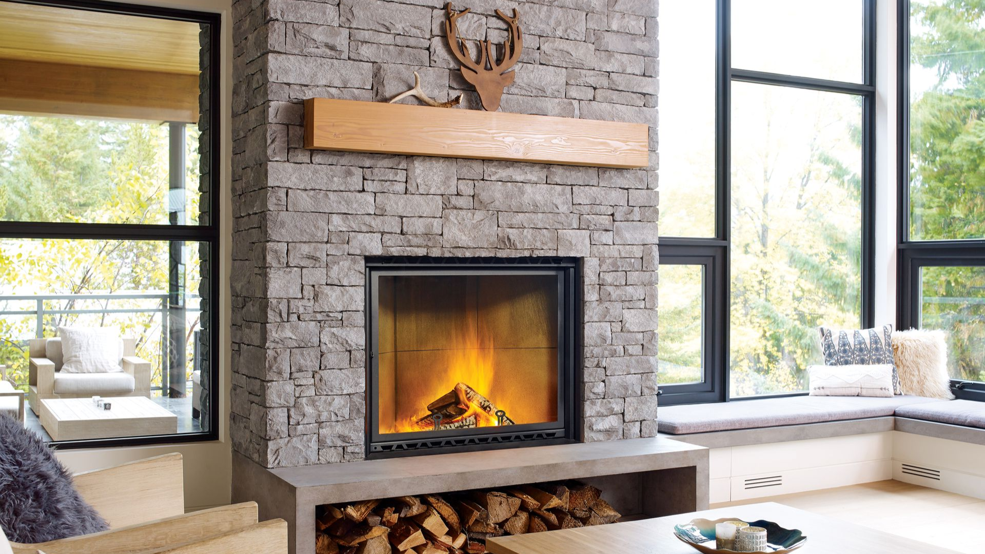 Traditional wood-burning fireplace with natural flame ambiance and stone fireplace design in a comfortable living room.