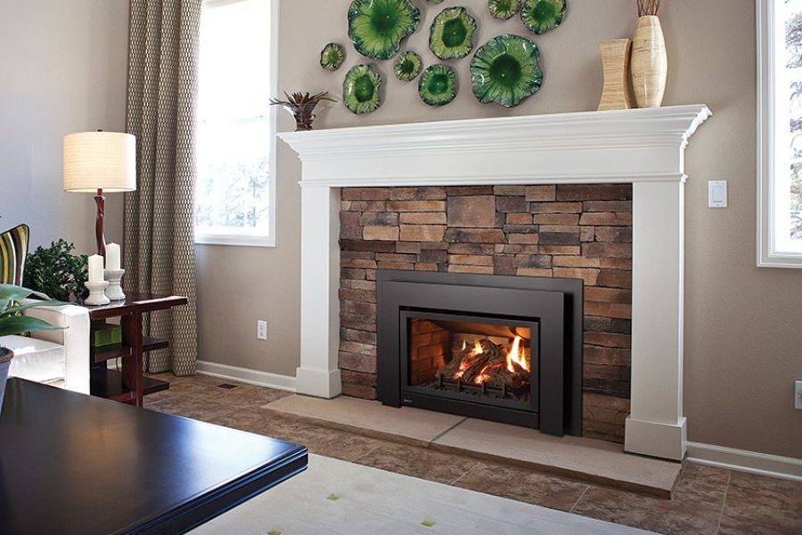 Updated fireplace with modern gas insert providing reliable warmth in Ocean Shores, WA