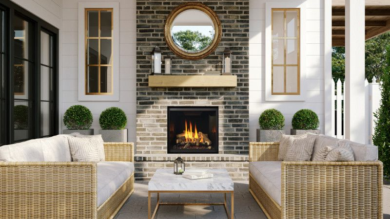 Covered outdoor living area featuring a gas fireplace and comfortable patio seating in Olympia, WA