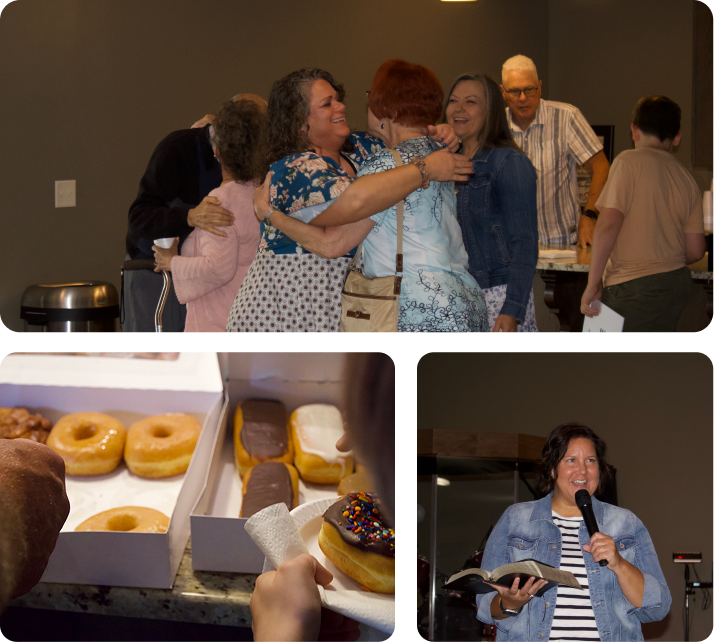People socializing at an indoor gathering, sharing hugs and donuts, with a woman speaking into a microphone