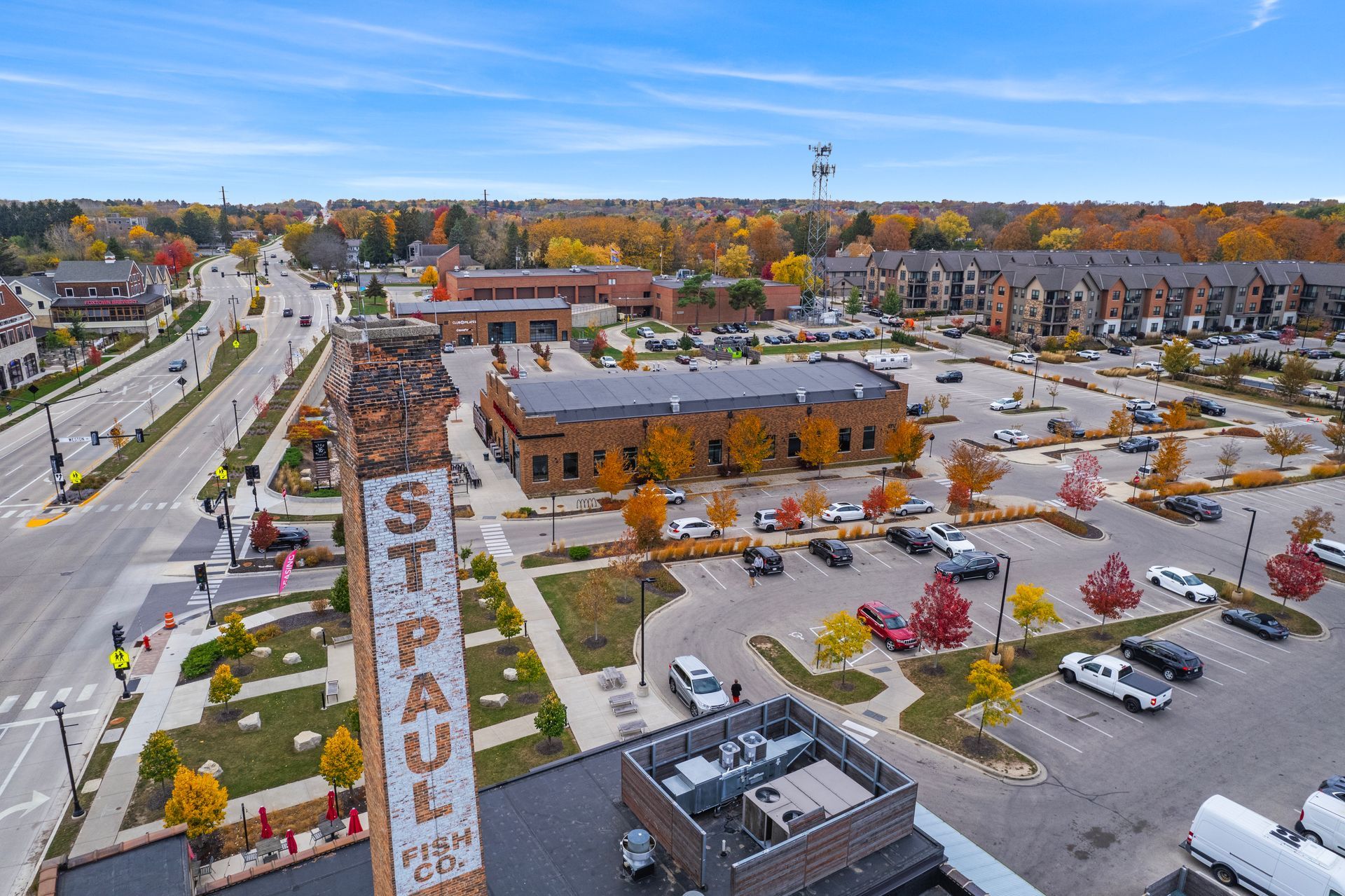 Aerial view of Mequon town square with brick buildings and a large