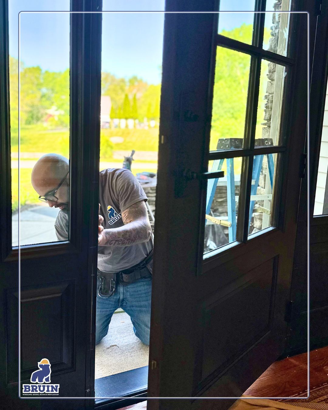 Person stepping through a glass doorway into a bright outdoor patio area