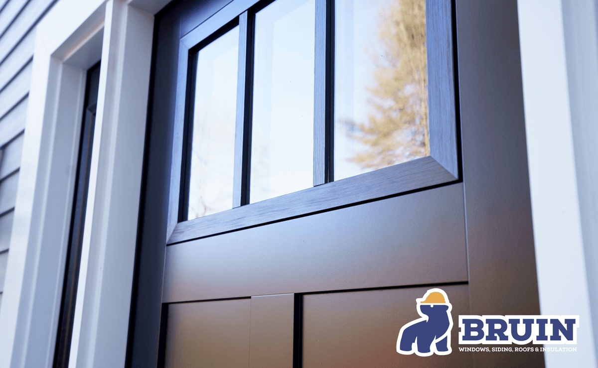 A black door with a bruin logo on it