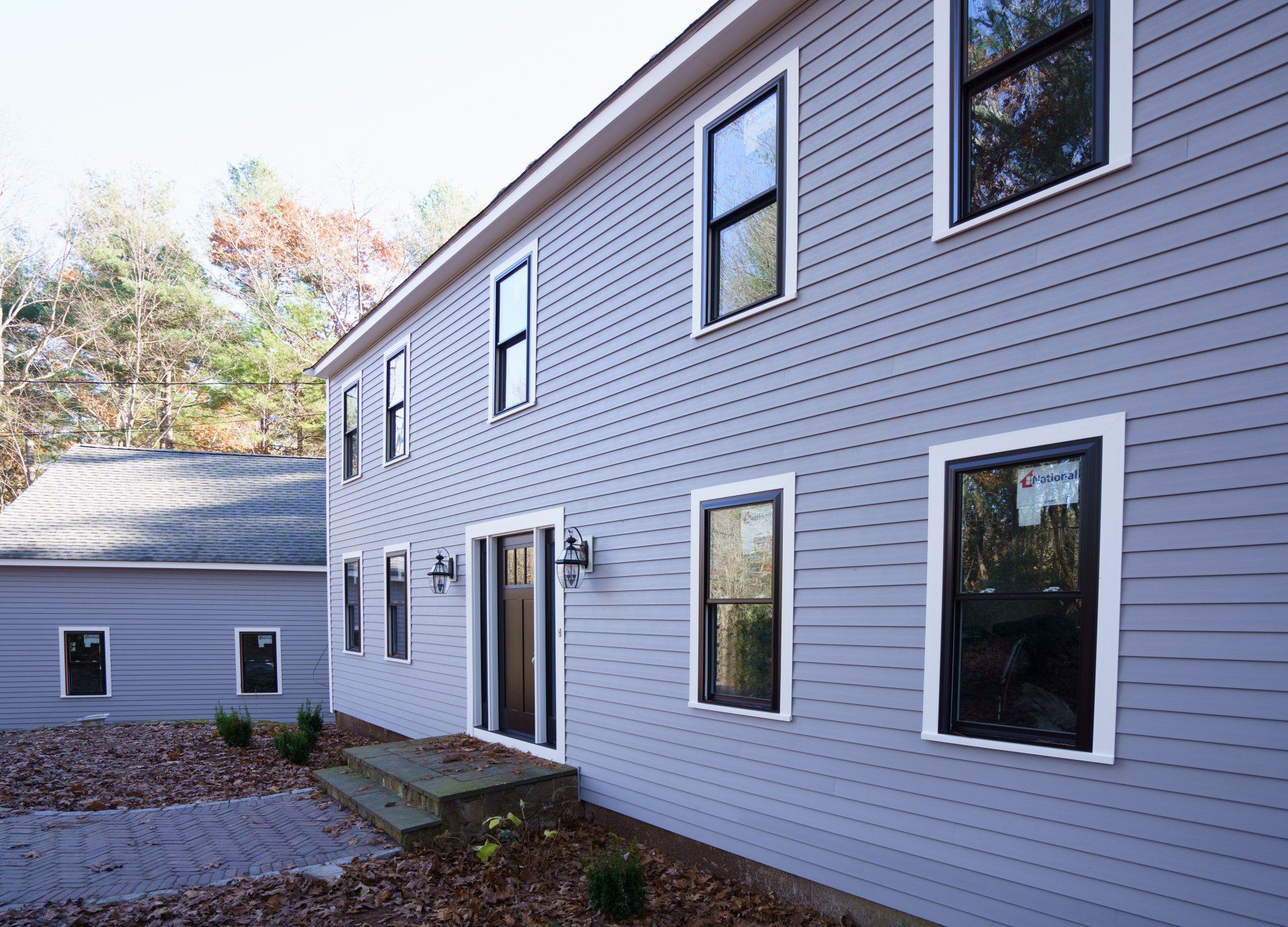 A large house with a lot of windows on it