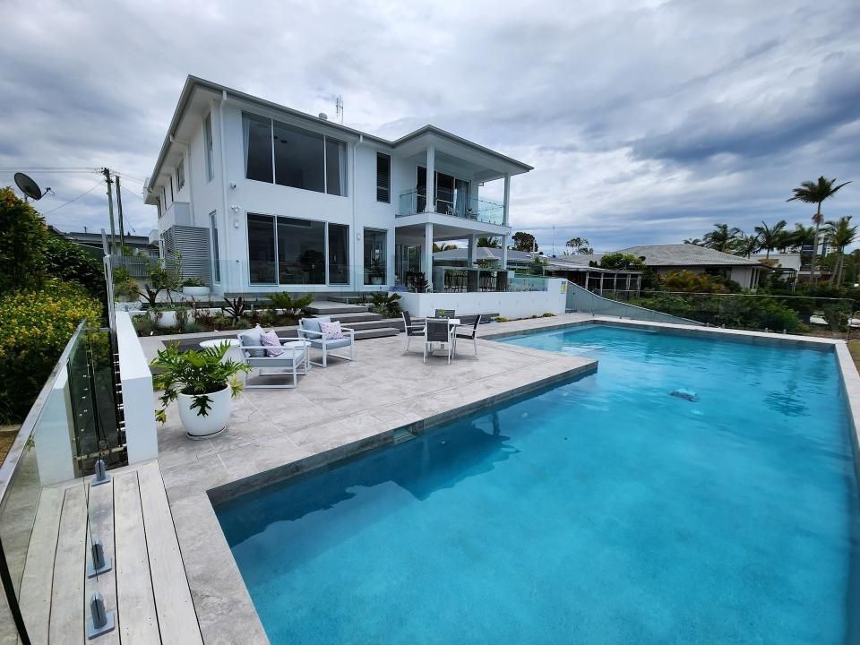 Custom concrete swimming pool by Pool Builders Sunshine Coast overlooking Mooloolaba waterfront