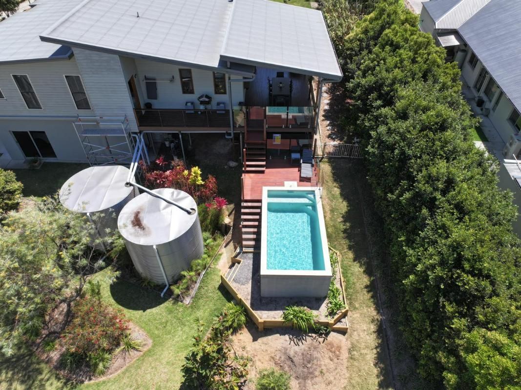 An Aerial View of a House With a Swimming Pool in the Backyard — Pools By Design in Noosa, QLD