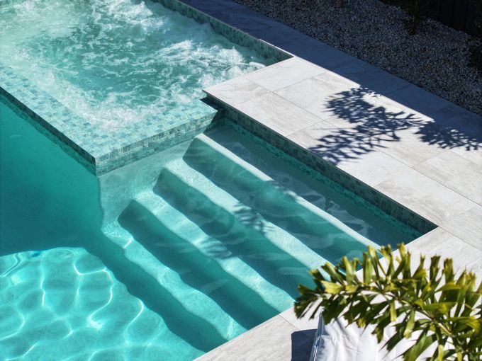 Modern backyard pool with premium finishes by Pool Builders Sunshine Coast