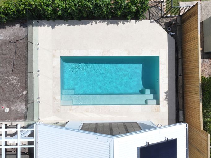 Stylish in-ground swimming pool designed and built by Pool Builders Sunshine Coast