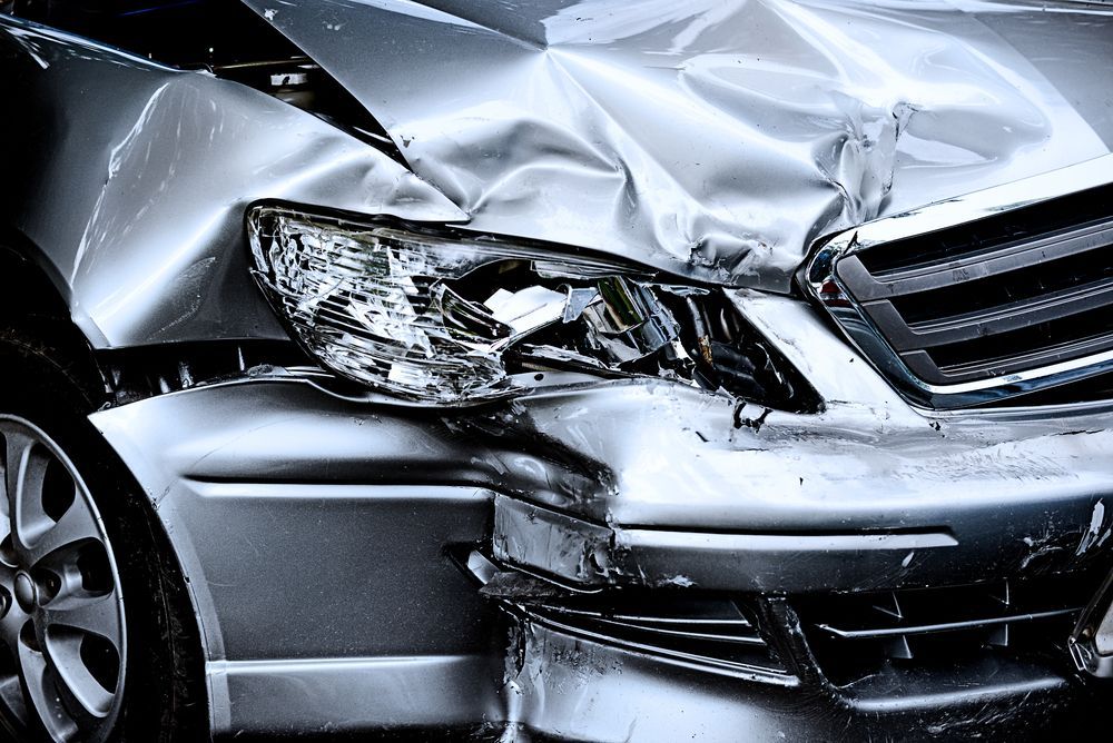 Crushed Front End of a Silver Car, Indicating a Severe Collision — Airlie Beach Smash Repairs in Cannonvale, QLD