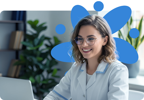 Woman in lab coat smiles while using laptop; blue abstract graphic in background.