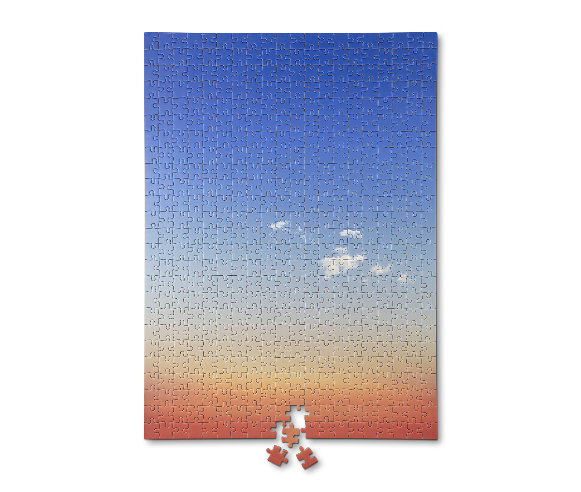 Ein Puzzle mit einem Bild eines Sonnenuntergangs darauf
