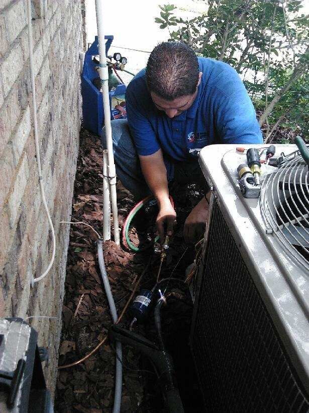man working on HVAC unit