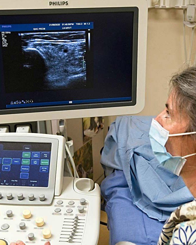 Sonographer reviews ultrasound image Sonographer reviews ultrasound image