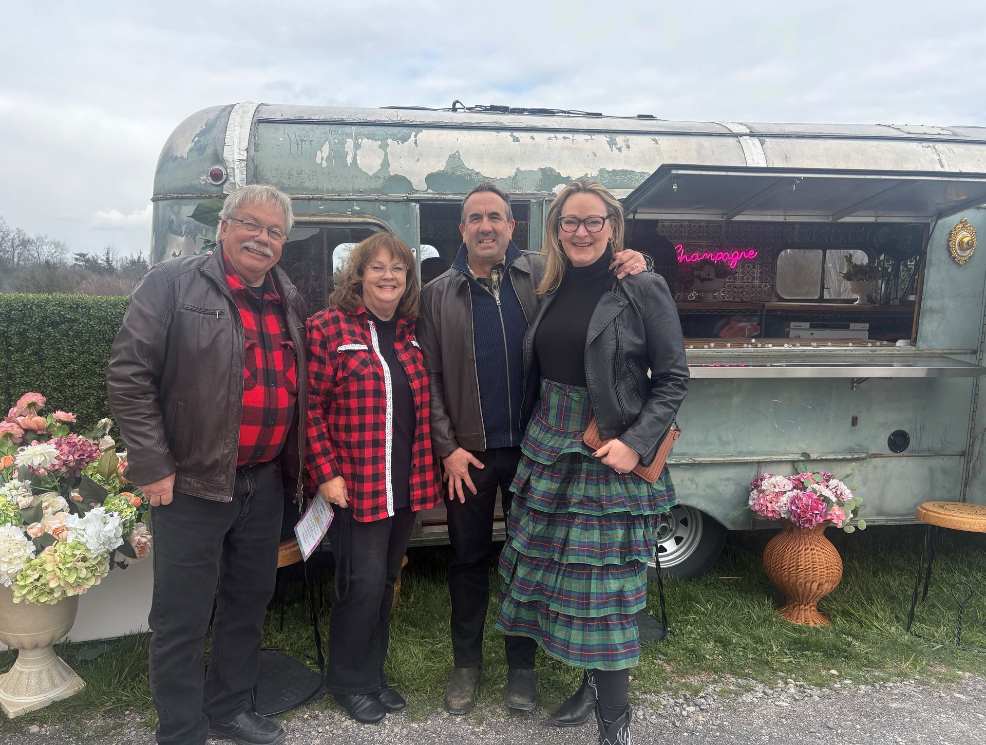 Gary Parks, Nancy Parks (Back the Build Campaign Chairperson), Daniel Curtin and Christine Faulhaber pose in front of C.H. Bespoked's trailer.